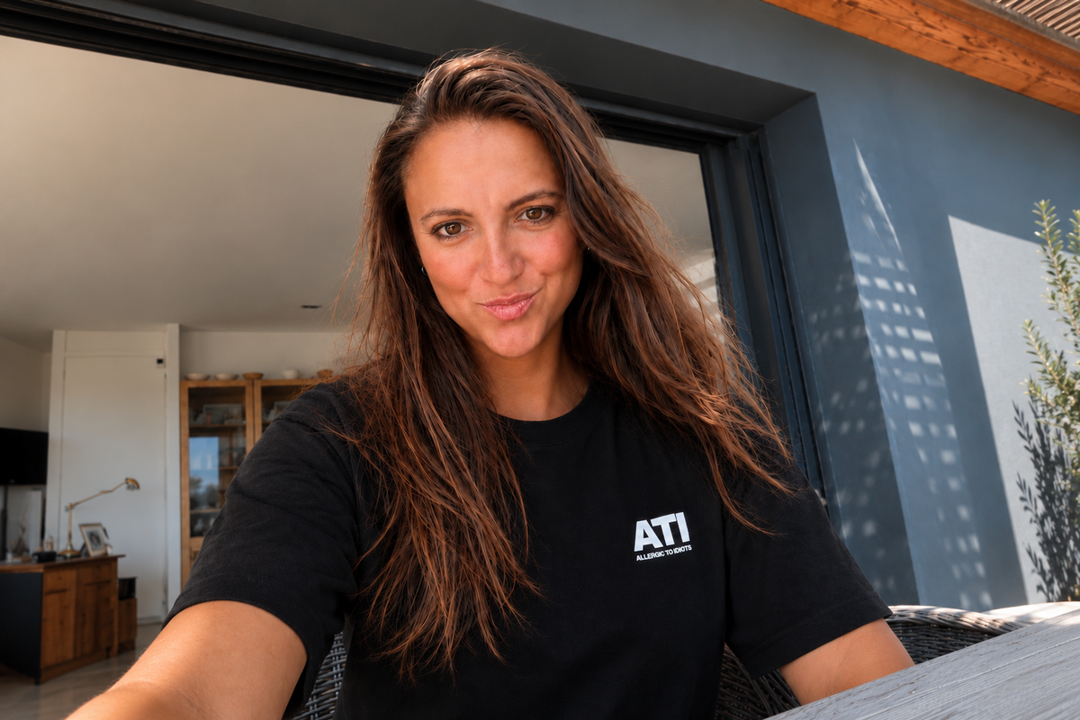 Portrait in an ATI T-shirt against a concrete wall